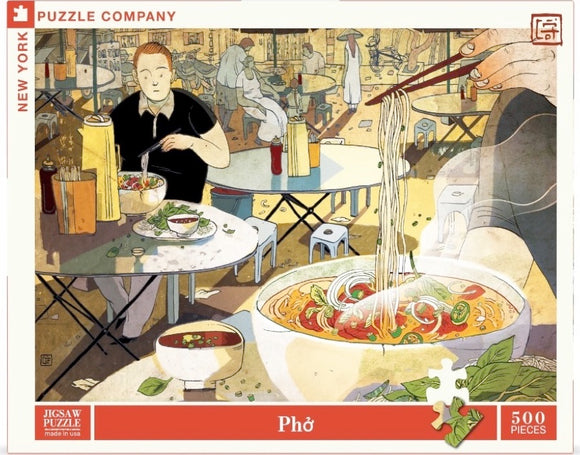 A vibrant jigsaw puzzle titled 'Phở' from New York Puzzle Company, featuring a bustling restaurant scene with a bowl of phở noodles. The puzzle is illustrated with a man enjoying his meal, surrounded by bowls and ingredients like herbs and chili, highlighting the warmth and culture of Vietnamese cuisine. It contains 500 pieces and is beautifully designed.