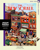 Main Street Jigsaw Puzzle (1000 pieces) showcasing a vibrant street scene illustrated by Beatrice Tobias, featuring shops, people, and vintage storefronts. The packaging includes elements of 1939 New Yorker magazine artwork.