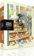 The Tag Sale Puzzle by New York Puzzle Company features a whimsical illustration of a dog and various items on a staircase, inviting puzzlers to recreate this charming scene with 1000 pieces. The box showcases a playful design with vibrant colors, perfect for any jigsaw puzzle enthusiast.