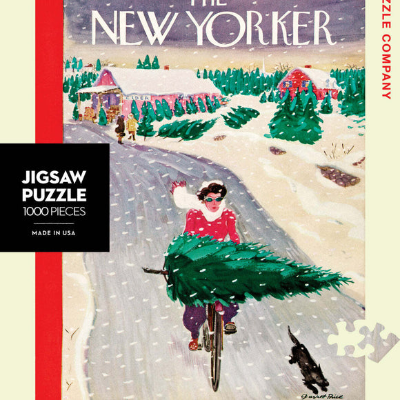 A vibrant 1000-piece jigsaw puzzle by New York Puzzle Company featuring a whimsical winter scene inspired by vintage New Yorker illustrations. The image depicts a woman in a red sweater riding a bicycle decorated with a Christmas tree while a black dog runs alongside on a snowy road. Snowflakes fall gently, enhancing the festive atmosphere with charming details of rustic homes and pine trees in the background.