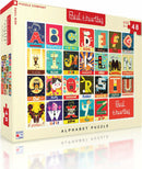A colorful jigsaw puzzle titled 'Alphabet' by New York Puzzle Company, featuring 48 pieces with vibrant illustrations representing each letter of the alphabet. The box displays a grid of artistic letters and related images, making it an engaging educational activity for children aged 3 and up.