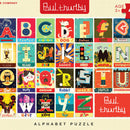 A colorful jigsaw puzzle by New York Puzzle Company titled 'Alphabet'. The puzzle features illustrated squares for each letter of the alphabet, showcasing fun and playful designs, including imagery related to words like 'Awesome', 'Dog', 'Mountain', and more. Suitable for ages 3 and up, the puzzle enhances letter recognition and provides a creative learning experience.