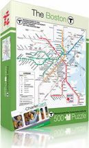 A 500-piece jigsaw puzzle featuring the Boston T subway map. The puzzle box showcases vibrant subway lines in various colors along with key bus routes, illustrations of characters, and the text 'Made in USA'.