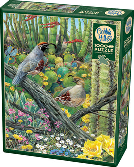 Cobble Hill Jigsaw Puzzle titled 'Courtship' featuring vibrant artwork of two quail birds amidst colorful flowers and cacti in a lush landscape. The puzzle includes 1000 pieces and comes with a poster.
