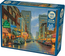 A Grand Night in Steubenville jigsaw puzzle by Cobble Hill featuring a vibrant street scene illuminated by neon signs and reflecting lights on wet pavement. The puzzle contains 500 pieces and includes a poster for reference.