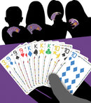 An engaging scene from the card game Five Crowns by Set Games. Featuring a close-up of various playing cards laid out on a purple table, with silhouettes of players in the background holding their own cards. The cards display colorful suits and numbers, emphasizing a fun and competitive atmosphere.