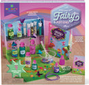 Craft Tastic's Make Your Own Fairy Potions DIY kit featuring colorful bottles and sparkling ingredients. Includes a potion book and supplies to create 9 magical fairy potions and necklaces. The packaging showcases whimsical designs with fairies and a vibrant rainbow.