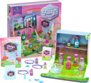 Craft Tastic's 'Make Your Own Fairy Potions' DIY kit featuring colorful potion bottles, sparkly ingredients, and an illustrated guide. Includes materials to create magical potions and wear them as necklaces, set in a whimsical fairyland display.
