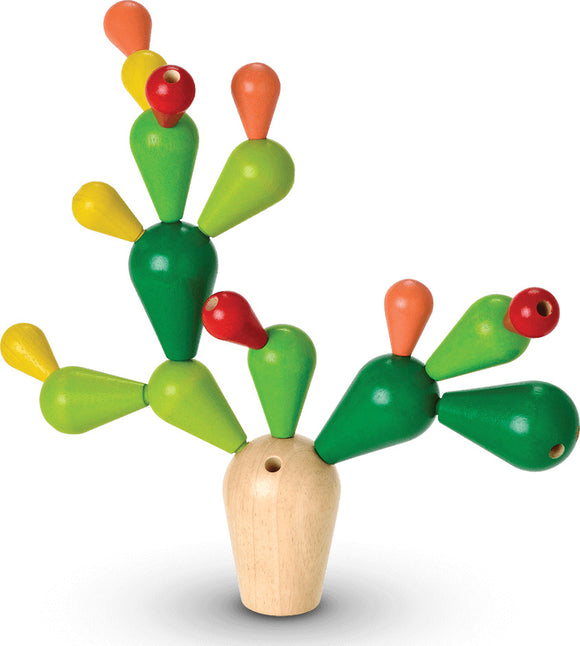 Balancing Cactus game by Plan Toys featuring brightly colored wooden cactus shapes balancing on a central wooden base. Designed for developing fine motor skills and encouraging creativity, this playful game is suitable for children.