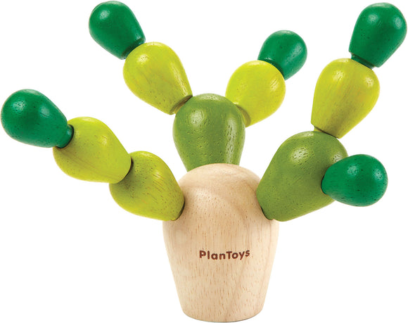 The Balancing Cactus Mini game from Plan Toys features a whimsical design with a base resembling a cactus pot, topped with vibrant wooden pegs in shades of green and yellow. These movable pieces allow for creative stacking and balance challenges, making it a fun and engaging game for children that promotes fine motor skills and coordination.