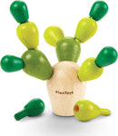 A Balancing Cactus Mini game by Plan Toys featuring a wooden cactus with colorful green and yellow pegs. The game encourages coordination and balance as players stack the pegs on the base. Perfect for developing fine motor skills and provides interactive fun for kids.