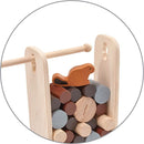 Timber Tumble game by Plan Toys features a wooden frame with a red-brown beaver character resting on top of colorful, cylindrical wooden blocks stacked inside. This engaging stacking game encourages fine motor skills and creative play for children.