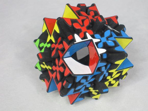 Maltese Gear by Project Genius is a colorful mechanical puzzle featuring a unique star-shaped design with vibrant red, blue, green, yellow, and black pieces. The puzzle has intricate interlocking mechanisms that provide a fun and challenging experience, perfect for puzzle enthusiasts and collectors. Ideal for all ages, it encourages problem-solving skills and offers hours of entertainment.