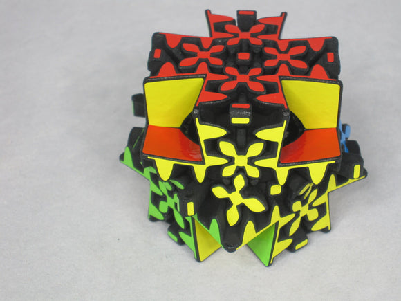 A colorful mechanical puzzle featuring intricate shapes and patterns. The puzzle is composed of various colors including red, yellow, green, and blue. Its unique design encourages critical thinking and problem-solving skills, making it an engaging challenge for users of all ages.