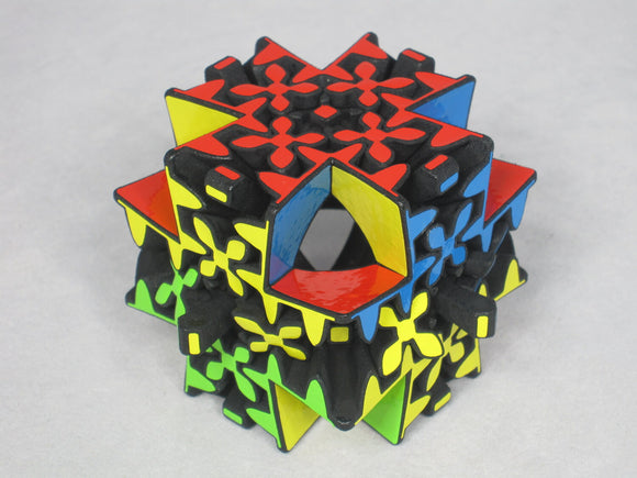 Maltese Gear by Project Genius is a colorful mechanical puzzle featuring an intricate design with various shapes and vibrant colors including red, yellow, blue, green, and black. This unique puzzle challenges users to manipulate its pieces to achieve a specific configuration, perfect for puzzle enthusiasts looking for a stimulating brain workout.