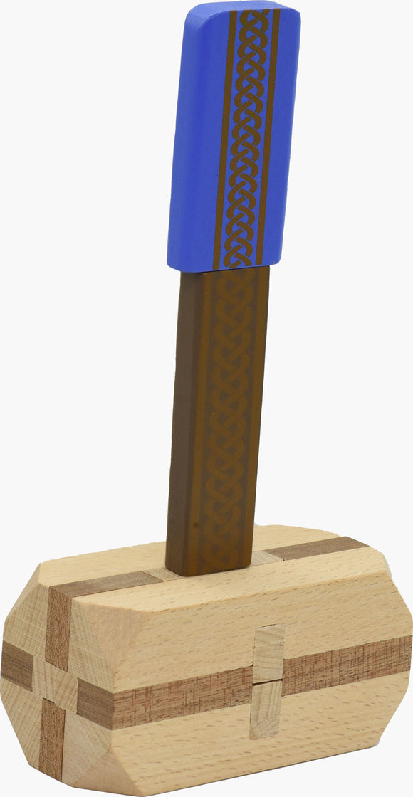 A mechanical puzzle designed like Thor's Hammer, featuring a vibrant blue handle adorned with intricate geometric patterns. The sturdy base is crafted from light and dark wood, showcasing elegant detailing. This visually striking piece is perfect for puzzle enthusiasts seeking a challenging and fun activity.
