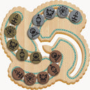 Egyptian Coin Trade by Project Genius is a mechanical puzzle featuring intricately designed coins with hieroglyphs. The puzzle showcases various symbols of ancient Egypt on a wooden board, connected by a vibrant blue chain, encouraging strategic thinking and problem-solving skills.