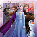 A vibrant jigsaw puzzle titled 'The Journey Starts' featuring popular characters from Disney's Frozen. The image includes Elsa in a sparkling blue dress, Anna with flowing red hair, Kristoff with a rugged look, Sven the reindeer, and Olaf the snowman against a colorful autumn background.
