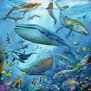 A vibrant underwater scene featuring a variety of ocean life, including whales, dolphins, and colorful fish amidst coral reefs. This detailed and artistic depiction invites puzzle enthusiasts to engage with the beauty of marine life. Perfect for family fun or individual challenge.