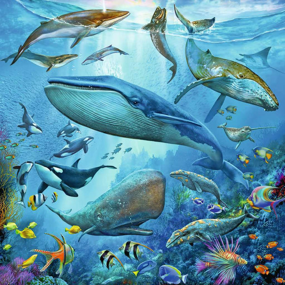 A vibrant underwater scene featuring a variety of ocean life, including whales, dolphins, and colorful fish amidst coral reefs. This detailed and artistic depiction invites puzzle enthusiasts to engage with the beauty of marine life. Perfect for family fun or individual challenge.