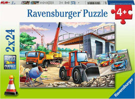 Ravensburger Construction & Cars jigsaw puzzle box featuring a scene with construction vehicles such as a tractor and crane, alongside a group of colorful sports cars. The design emphasizes creativity and fun for children aged 4 and above.