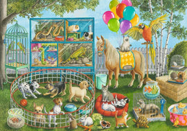 A colorful jigsaw puzzle titled 'Pet Fair Fun' depicting a lively scene with various pets in a garden. There are playful puppies and kittens, birds in cages, a horse, and other small animals surrounded by toys and decorations, set under sunny trees with balloons in the sky.