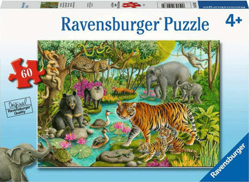 A colorful jigsaw puzzle illustration featuring various animals from India. It shows a tiger and two cubs walking beside a river with water lilies, while elephants, a bear, a leopard, and several birds are visible in a lush, green forest setting. The design showcases the biodiversity of India's wildlife in vibrant detail.