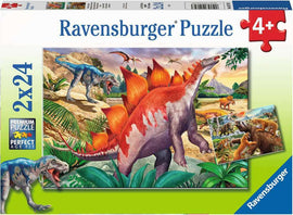 Ravensburger Jurassic Wildlife jigsaw puzzle featuring colorful and detailed illustrations of various dinosaurs in a prehistoric landscape. The 2-in-1 puzzle includes two 24-piece puzzles, showcasing a vibrant scene with a large Stegosaurus and a blue dinosaur, surrounded by lush vegetation and mountains. Perfect for young dino enthusiasts aged 4 and up.