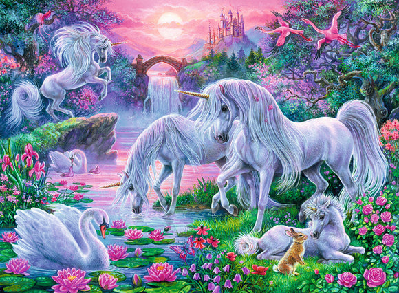 A vibrant jigsaw puzzle titled 'Unicorns in the Sunset Glow' by Ravensburger, depicting a magical scene with four white unicorns in a lush landscape filled with blooming flowers, swans on a tranquil pond, and a castle in the background under a colorful sunset sky.
