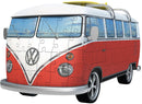 A Ravensburger jigsaw puzzle featuring a vintage VW Bus T1. The puzzle showcases the iconic red and white color scheme of the vehicle, with detailed features including the round headlights and the Volkswagen logo prominently displayed. The bus is parked against a backdrop of blue skies, inviting a sense of nostalgia and adventure.