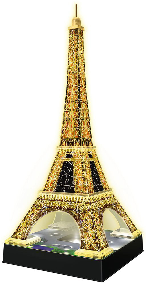 A stunning 3D puzzle of the Eiffel Tower in night edition, lit up with vibrant lights. The jigsaw puzzle showcases intricate details and a glossy finish, capturing the essence of the iconic Parisian landmark. It stands elegantly on a black base, highlighting its architectural brilliance and decorative charm, perfect for puzzle enthusiasts and collectors alike.