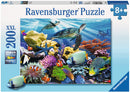 Ravensburger jigsaw puzzle featuring a vibrant underwater scene with ocean turtles gliding through colorful coral reefs inhabited by various tropical fish. The box indicates this puzzle contains 200 XXL pieces and is suitable for ages 8 and up, highlighting the premium quality of the puzzle for an engaging experience.