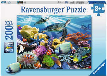 Ravensburger jigsaw puzzle featuring a vibrant underwater scene with ocean turtles gliding through colorful coral reefs inhabited by various tropical fish. The box indicates this puzzle contains 200 XXL pieces and is suitable for ages 8 and up, highlighting the premium quality of the puzzle for an engaging experience.