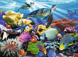 A vibrant jigsaw puzzle featuring ocean turtles swimming gracefully among a colorful underwater scene filled with coral reefs, tropical fish, and marine life. The image depicts a serene ocean environment with multiple turtles and various species of fish, showcasing the beauty of marine biodiversity.