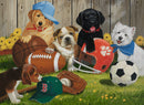 A colorful jigsaw puzzle featuring playful puppies surrounded by various sports equipment. The scene includes a golden retriever wearing a blue cap, a bulldog, a black labrador, and a small white dog with a blue bandana. They are playing with a football, a basketball, a baseball glove, and a soccer ball, set against a backdrop of a wooden fence and flowers.