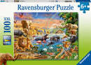 A vibrant jigsaw puzzle featuring a lively Savannah jungle waterhole scene. The artwork depicts various animals including elephants, lions, zebras, and a hippo in a colorful landscape with lush greenery and a waterfall, creating an engaging and immersive puzzle experience.