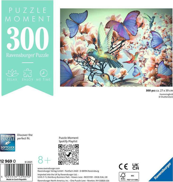 A Ravensburger jigsaw puzzle titled 'Hummingbird', featuring a colorful design with vibrant hummingbirds and butterflies set against a floral background. The puzzle contains 300 pieces and measures 27 x 39 cm, intended for ages 8 and up. Ideal for relaxation and mindful enjoyment.