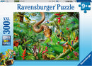 Ravensburger Reptile Resort Jigsaw Puzzle featuring a vibrant jungle scene filled with various reptiles, amphibians, and exotic flora. The puzzle contains 300 pieces and is designed for ages 9 and up, showcasing a detailed illustration of colorful chameleons, frogs, butterflies, and a snake coiled among the lush greenery.
