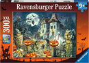 A vibrant jigsaw puzzle box featuring a spooky Halloween scene designed by Ravensburger. The illustration showcases a haunted house surrounded by pumpkins, ghosts, bats, and other eerie elements, perfect for family fun during the Halloween season. Ideal for ages 9 and up, this 300-piece puzzle promises an engaging challenge and a festive atmosphere.