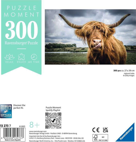 Ravensburger Puzzle Moments: Highland Cattle jigsaw puzzle featuring a vibrant image of a Highland cow in a scenic landscape. The puzzle has 300 pieces and measures approximately 27 x 39 cm, ideal for relaxation and enjoyment.