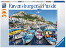 Ravensburger jigsaw puzzle titled 'Colorful Marina' featuring a vibrant scene of a marina filled with colorful boats surrounded by picturesque buildings and mountains under a clear blue sky. The puzzle contains 500 pieces and utilizes softclick technology for a perfect fit.