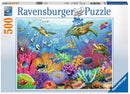 Ravensburger 500-piece jigsaw puzzle titled 'Tropical Waters', featuring a vibrant underwater scene populated with colorful coral reefs, various fish species, and turtles swimming in a serene ocean. The design showcases intricate details in marine life and vivid colors, perfect for ocean lovers and puzzle enthusiasts.