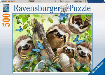 A cheerful jigsaw puzzle box featuring five adorable sloths amid lush green foliage and blue butterflies. The design is colorful and inviting, showcasing the natural habitat of these charming creatures. The puzzle contains 500 pieces and is made by Ravensburger, known for their quality puzzles.