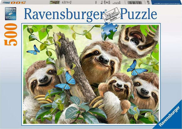 A cheerful jigsaw puzzle box featuring five adorable sloths amid lush green foliage and blue butterflies. The design is colorful and inviting, showcasing the natural habitat of these charming creatures. The puzzle contains 500 pieces and is made by Ravensburger, known for their quality puzzles.