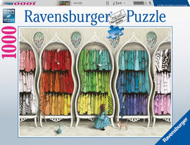 The Fantastic Fashionist jigsaw puzzle by Ravensburger features a whimsical scene of a young girl discovering a vibrant wardrobe filled with colorful dresses. Displayed in elegantly designed cabinets, the dresses range from soft pinks to vivid blues and greens, inspiring creativity and imagination. This 1000-piece puzzle captures the magic of fashion and storytelling in enchanting detail.