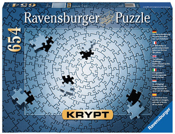 Ravensburger Krypt Silver jigsaw puzzle box featuring a unique design with interlocking puzzle pieces in shades of blue and black. The box is labeled with the puzzle's name 'Krypt' and includes the number of pieces, 654, alongside various languages describing a puzzling challenge without an image, emphasizing the necessity to build the puzzle by piece shapes.