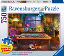 Puzzler's Place Jigsaw Puzzle by Ravensburger featuring a cozy indoor scene with a colorful puzzle spread out on a wooden table. Surrounded by a purple chair, cats lounging, bookshelves, and a warm fireplace, this 750-piece puzzle showcases vibrant colors and intricate details, perfect for puzzle enthusiasts.