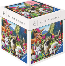 Llama jigsaw puzzle by Ravensburger featuring a colorful design with llamas adorned in vibrant decorations set against a scenic mountainous background. The packaging displays '99 pieces' and the phrase 'Puzzle Moment.' This fun and engaging puzzle is perfect for llama lovers and puzzle enthusiasts.