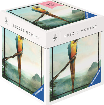 A Ravensburger jigsaw puzzle titled 'Parrot' featuring a colorful parrot perched on a branch against a scenic landscape backdrop. The puzzle box displays 99 pieces and is part of the 'Puzzle Moment' series, showcasing intricate details and vibrant colors.