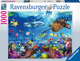 Ravensburger Jigsaw Puzzle featuring a vibrant underwater scene. The image showcases colorful tropical fish, a sea turtle, and dolphins swimming amidst coral reefs. The puzzle contains 1000 pieces, perfect for ocean lovers and puzzle enthusiasts. It highlights the intricate details of marine life and provides a visually stunning challenge. The puzzle box displays the soft-click technology label for easy assembly.